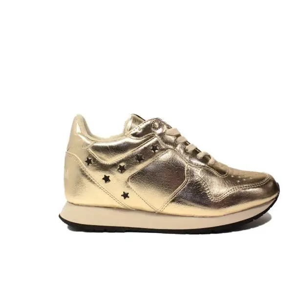 Tommy Hilfiger sneakers with low wedge gold color article FW0FW01877/901